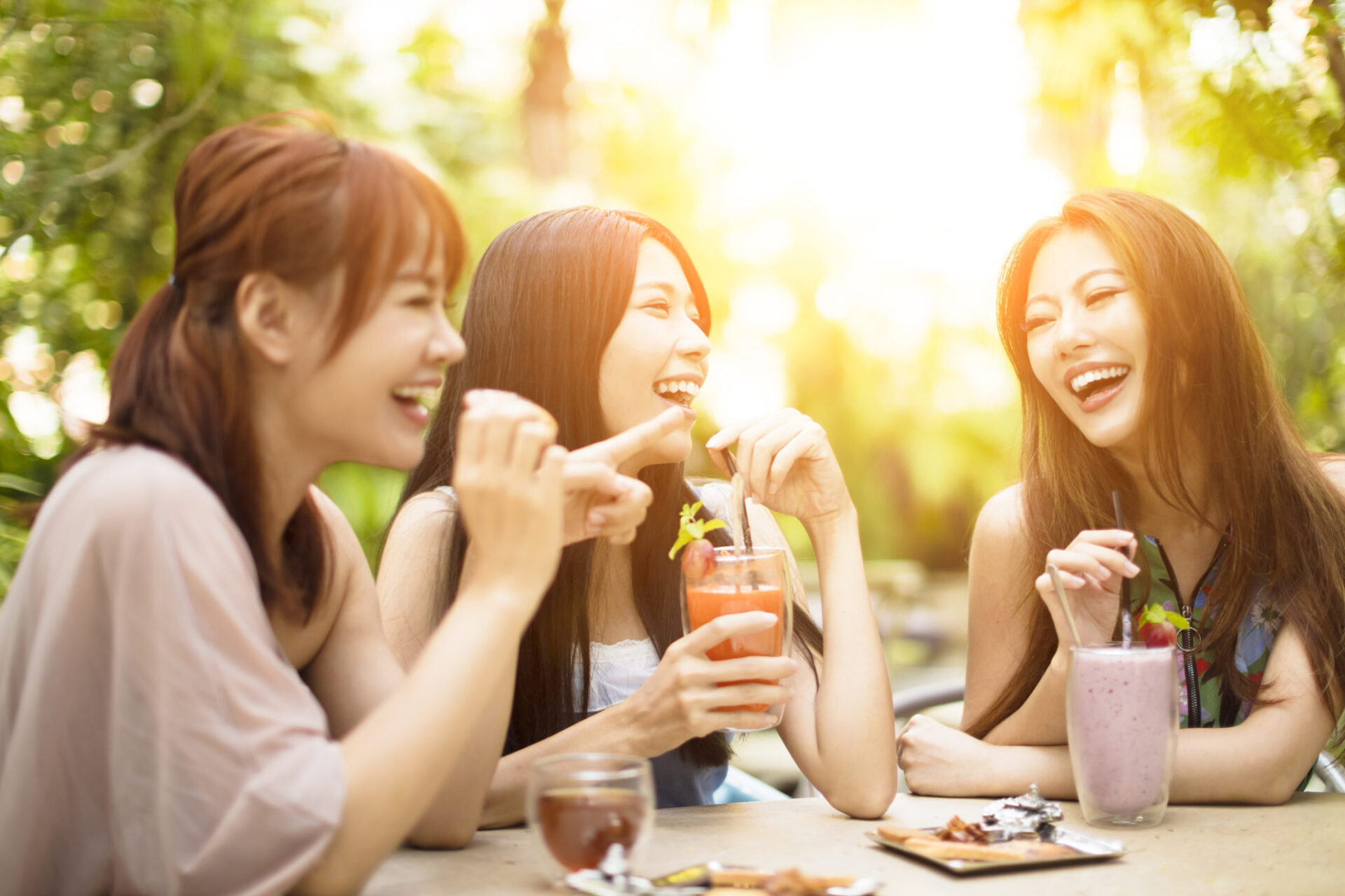 Group of young woman laughing in restaurant